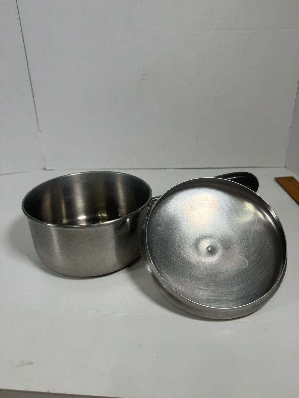 Stainless Steel Saucepan with Black Handle and Lid